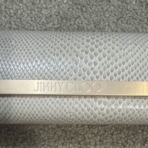 Jimmy Choo Textured sunglass case in Gray and Cream